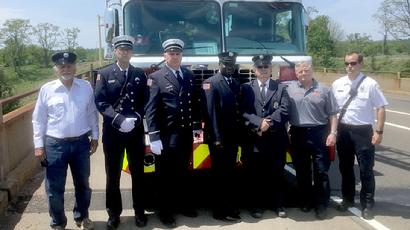 These gentlemen of the HFD joined with North Haven and East Haven firefighters at I-91's Bailey Street overpass in North Haven to salute Ff. Torres' funeral cortege as it headed north to Cedar Hill Cemetery in Hartford.  Left to right are Ff. Fred "Chick" Manware (Ret.), Lt. K.P. Martin, Lt. Jeff Woodford, Ff. Gary Greene, Ff. Don Pazcowski, Fire Insp. Paul Turner, and Lt/Training Officer Rich Lennon.